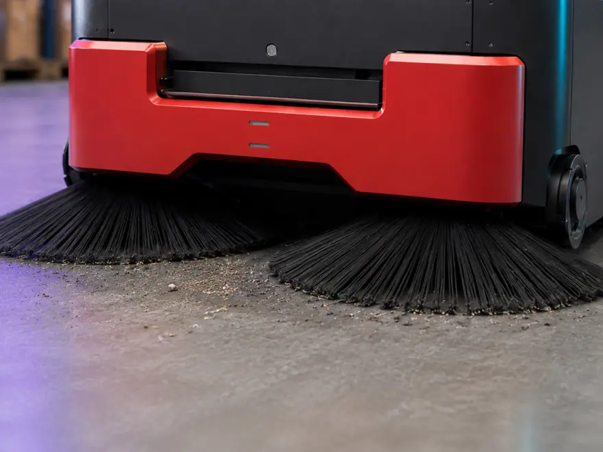 Close-up of the sweeping brushes on the ÆNIX PURE SWEEP robot